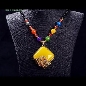 NWT Rhinestone Rose atop a Beeswax Pendant